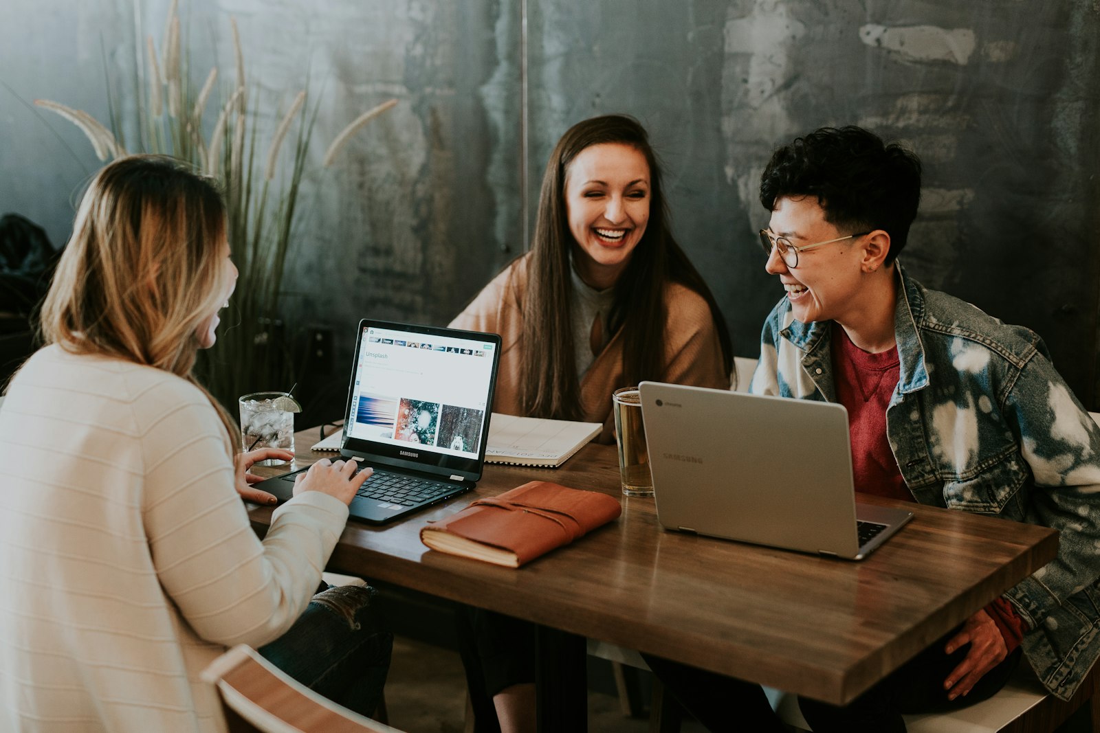 A group of students working together around a table.